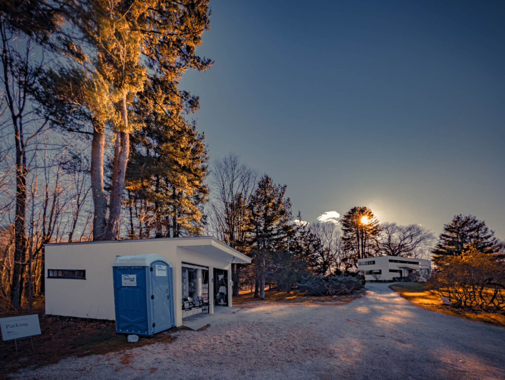 Gropius House, Lincoln, Massachussetts, b. 1939, Walter Gropius archit. (photo November 29, 2025): original garage, currently converted to visitor center, with house beyond