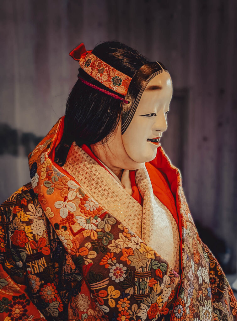 Sado Daizen Shrine Noh Stage, Takeda, Sado Island, rebuilt 1846 (Nov. 6, 2025): KY wearing antique 万媚 (Manbi, demon disguised as a young woman) nō-men and Karaori robe.