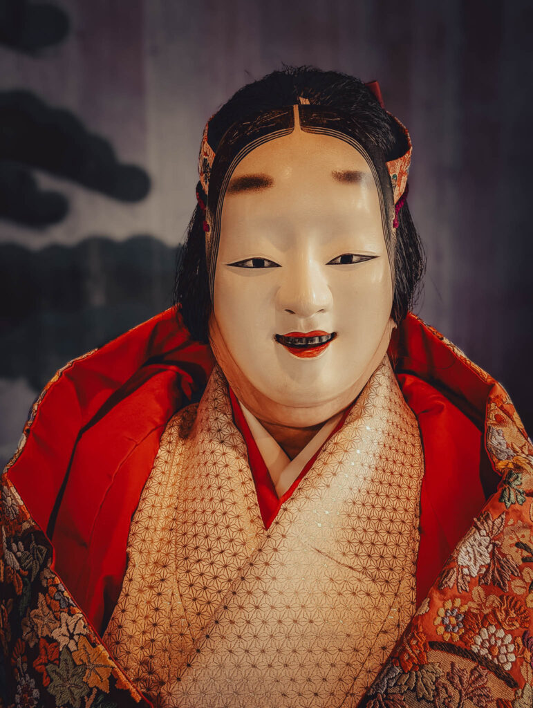Sado Daizen Shrine Noh Stage, Takeda, Sado Island, rebuilt 1846 (Nov. 6, 2025): KY wearing antique 万媚 (Manbi, demon disguised as a young woman) nō-men and Karaori robe.