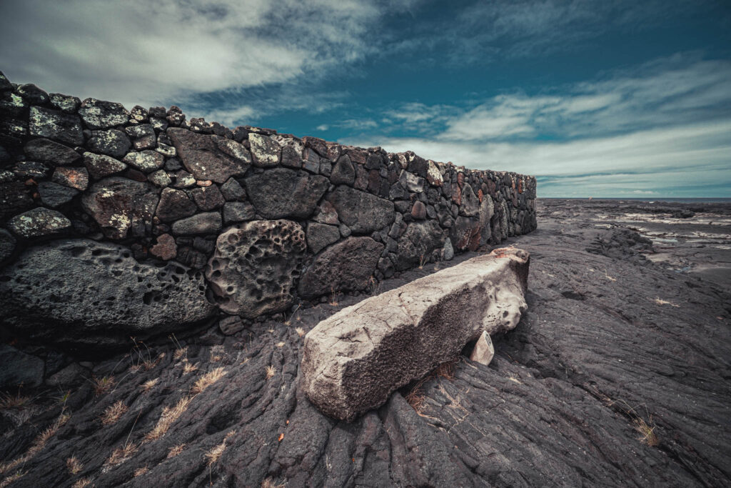 Puʻuhonua o Hōnaunau National Historical Park, Hōnaunau, Hawai'i (photo August 21, 2021): ʻĀleʻaleʻa heiau (māpele-style temple platform, burial site, and hula-viewing platform, oriented towards rising of star Arcturus) with Keōua Stone (partially-carved stone bench or canopy base).