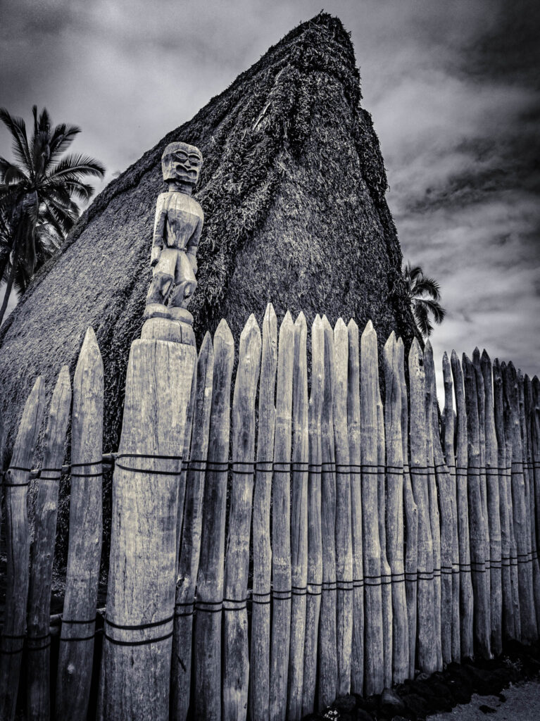 Puʻuhonua o Hōnaunau National Historical Park, Hōnaunau, Hawai'i (photo August 21, 2021): Hale o Keawe (mortuary temple built by or for ruler Keawe-i-kekahi-aliʻi-o-ka-moku c.1700, last restored 2004) with recreate ki'i (divinity statue).