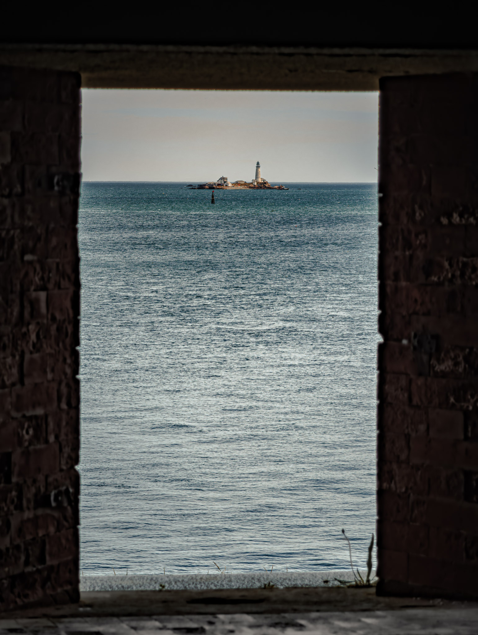 Fort Warren, Georges Island (photo June 19, 2026) Bastion A embrasure view of Boston Light, Little Brewster Island.