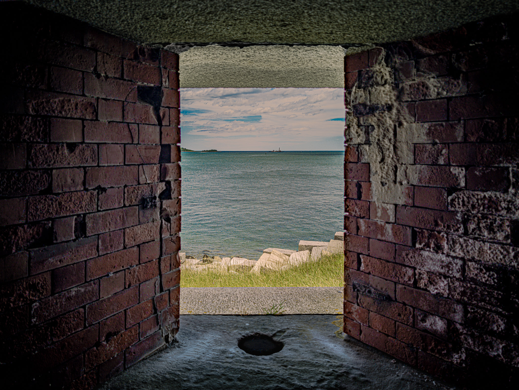 Fort Warren, Georges Island (photo June 19, 2026) Bastion A embrasure view of Boston Light, Little Brewster Island.