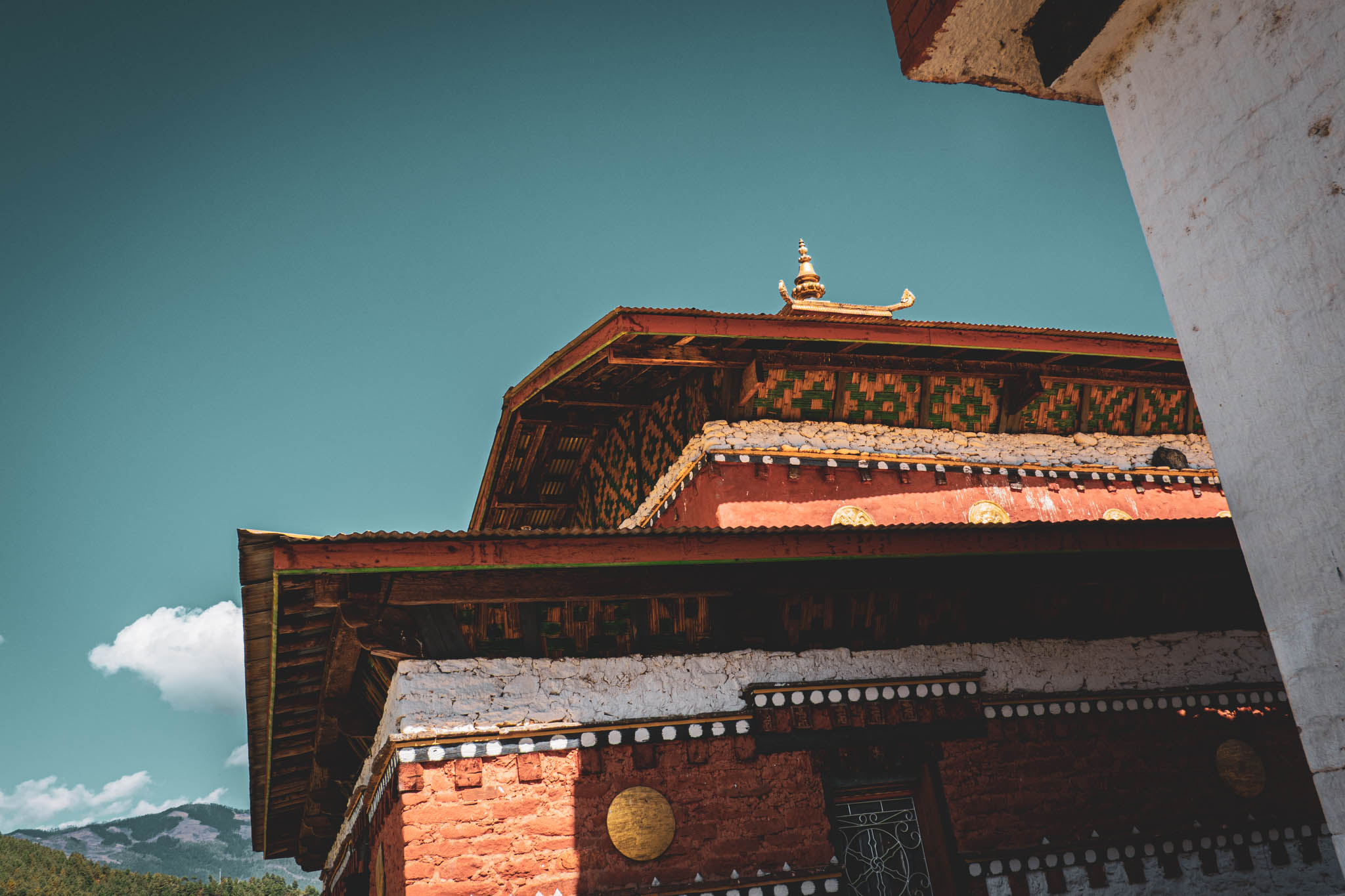 Jambay Lhakhang, Bumthang Valley, Bhutan, orig. 659 AD (photo Oct. 26, 2018) west exterior original Jampa Lhakhang ambulatory and sanctuary.