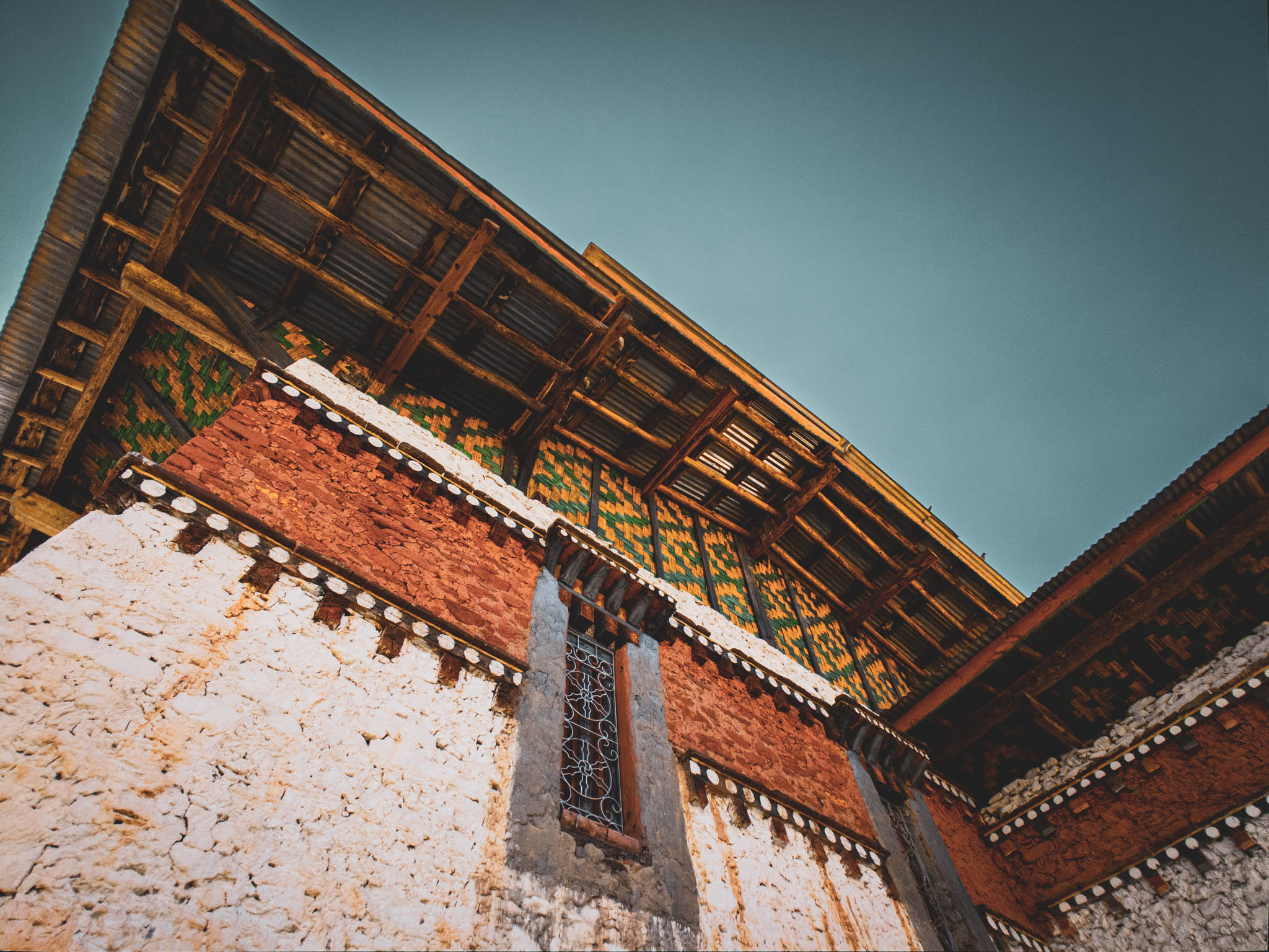 Jambay Lhakhang, Bumthang Valley, Bhutan, orig. 659 AD (photo Oct. 26, 2018) Sangye Lhahkang "flying roof" from below.