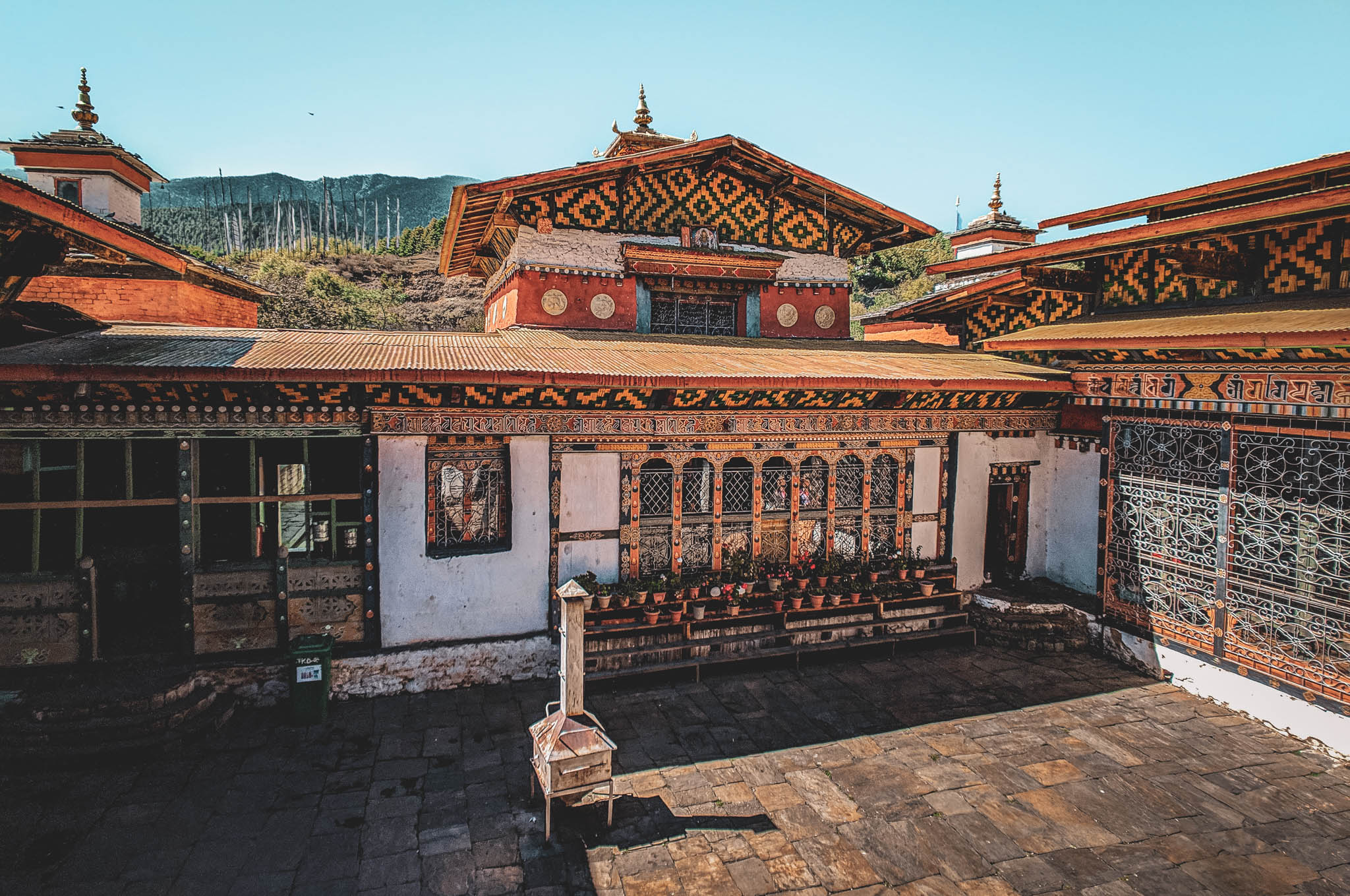 Jambay Lhakhang, Bumthang Valley, Bhutan, orig. 659 AD (photo Oct. 26, 2018) view from Sangye Lhakhang balcony of courtyard, original Jampa Lhakhang center, Dukhor Lhakhang right,