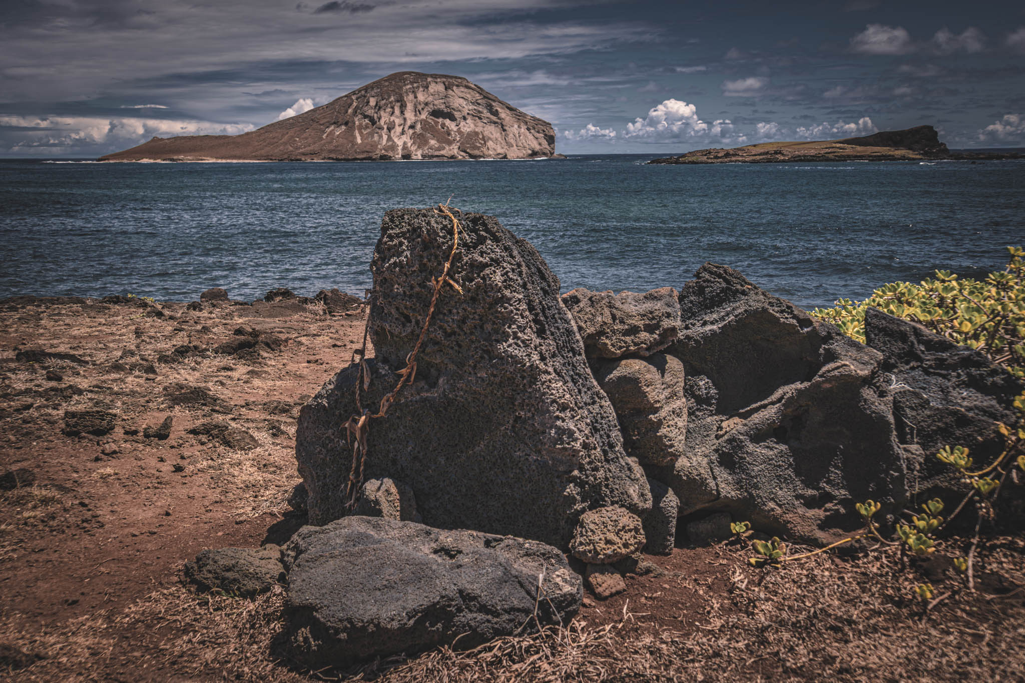 Makapu’u Heiau, Kalanianaʻole Highway, Oahu Island (photo 17 August 2021), with Kāohikaipu Islet (R) and Mānana Island (L) in far background.