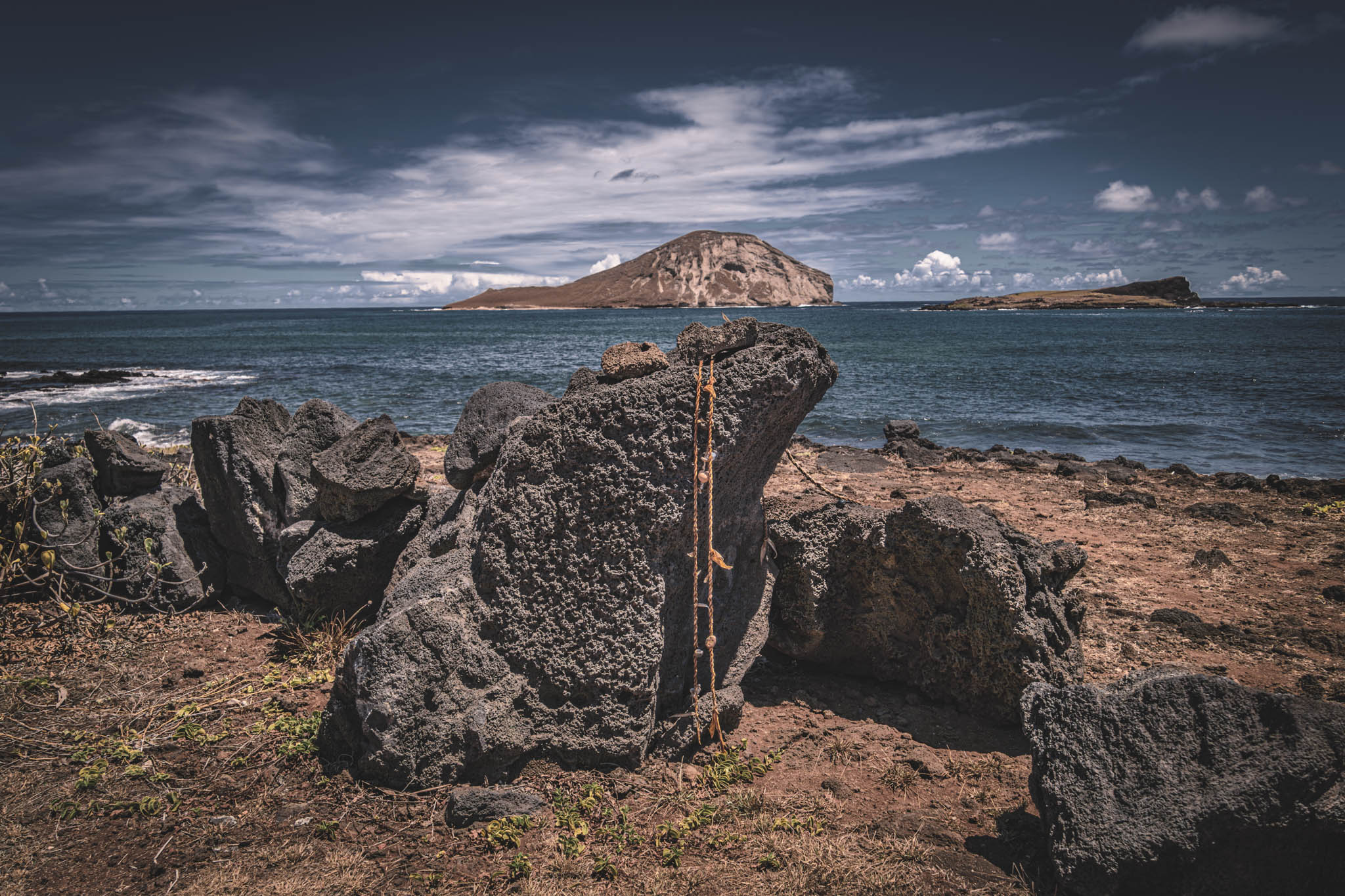 Makapu’u Heiau, Kalanianaʻole Highway, Oahu Island (photo 17 August 2021), with Kāohikaipu Islet (R) and Mānana Island (L) in far background.