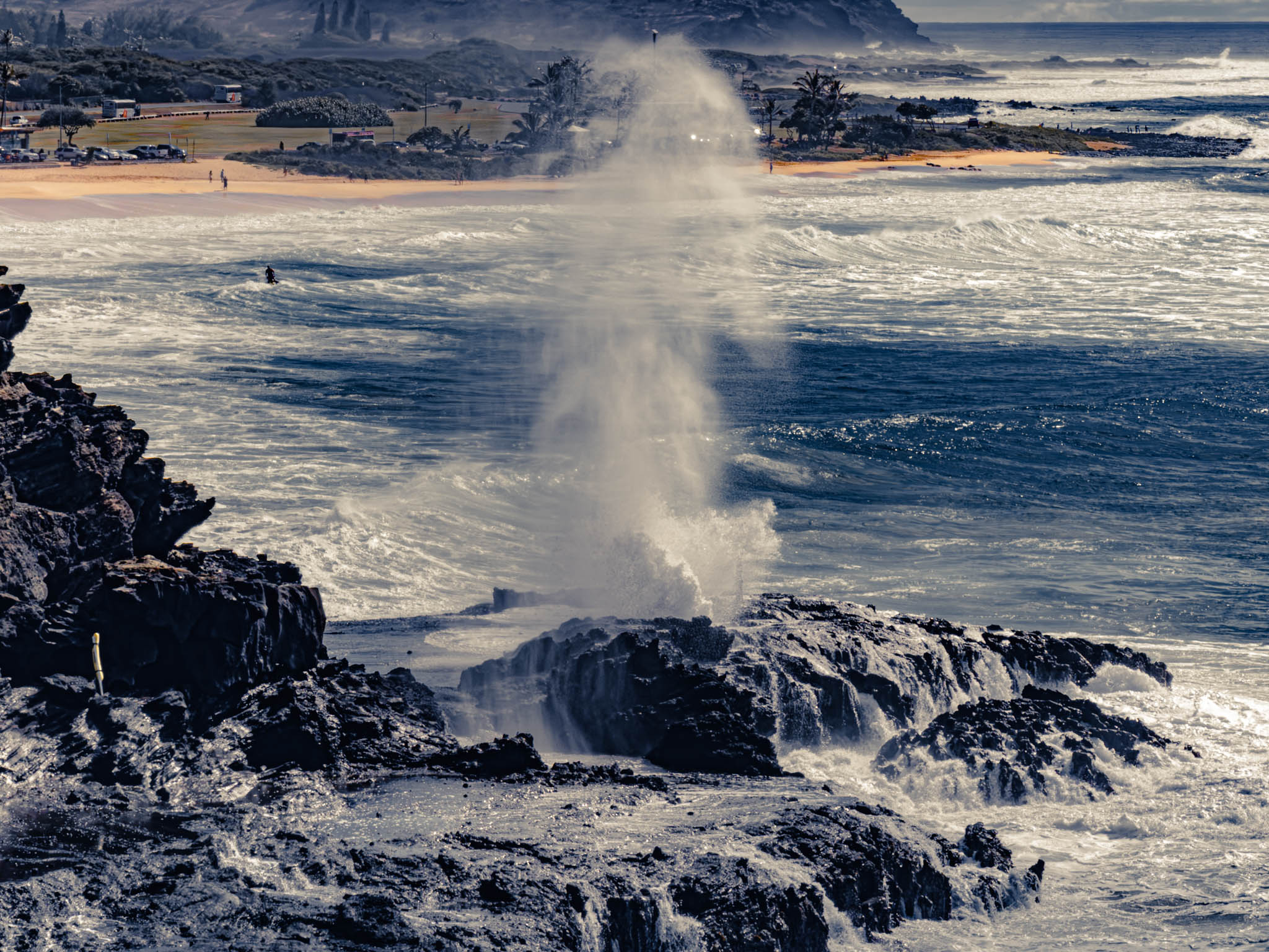 Halona Blowhole marine geyser, off of Kalanianaʻole Highway, Oahu Island (photo 17 August 2021), taken from the Japanese Fishing Shrine with telescopic lens.