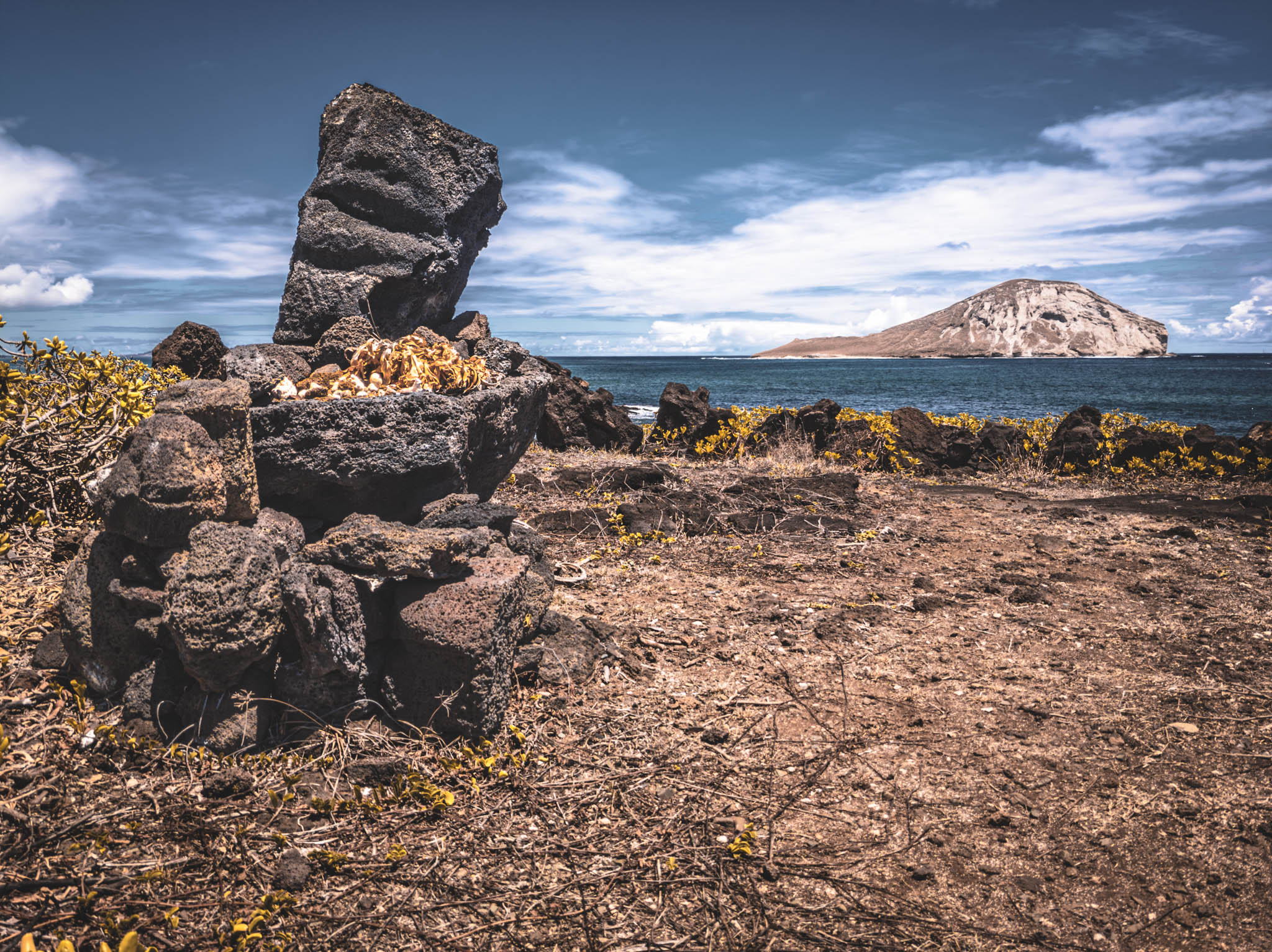 Makapu’u Heiau, Kalanianaʻole Highway, Oahu Island (photo 17 August 2021), with Kāohikaipu Islet (R) and Mānana Island (L) in far background.
