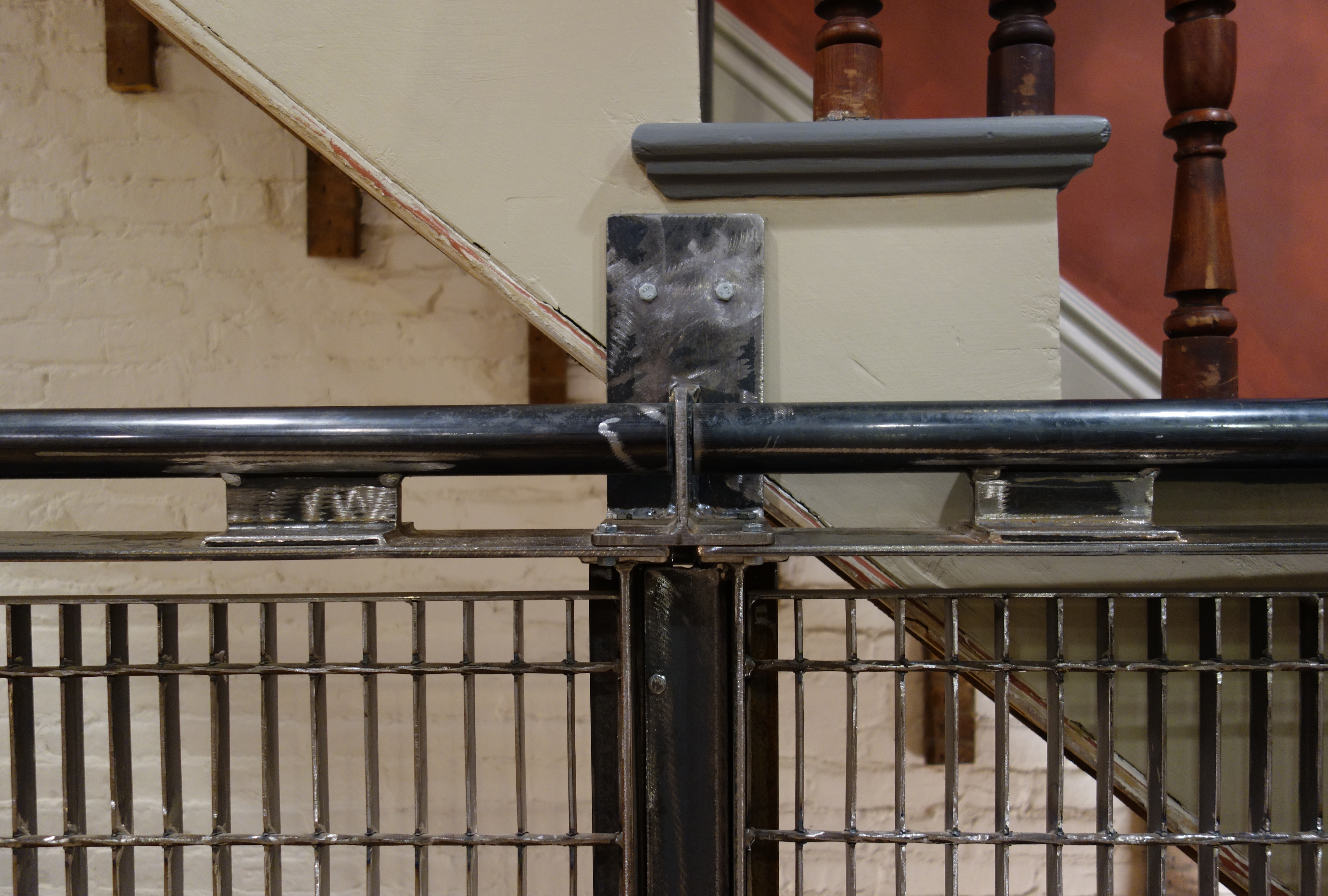 Subway Grate Guardrail (2016) installed, bracket detail